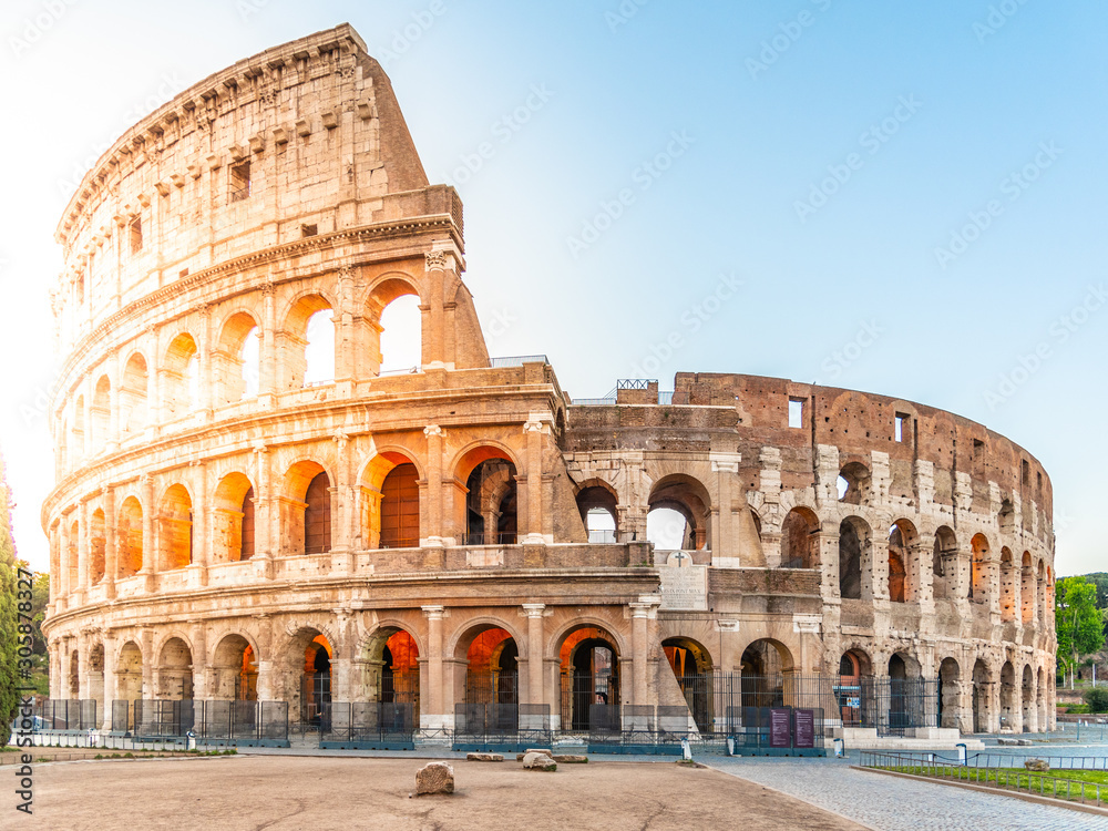 Colosseum, or Coliseum. Morning sunrise at huge Roman amphitheatre, Rome, Italy.