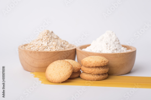 Close up of oat flake and wheat flour prepared for cooking on a white background