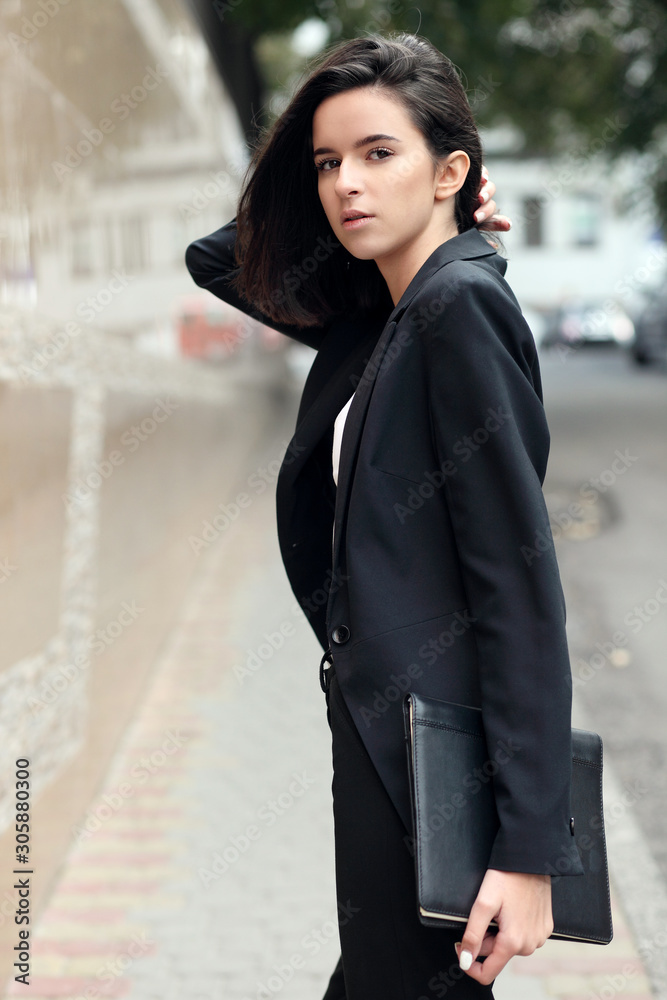 Portrait of a successful business woman smiling. Beautiful young female executive in an urban setting