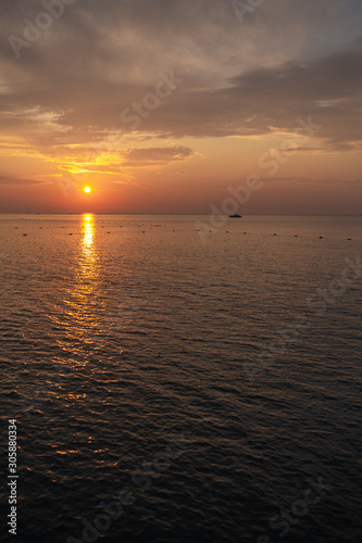 Vertical color photography of beautiful golden sunrise seascape. 