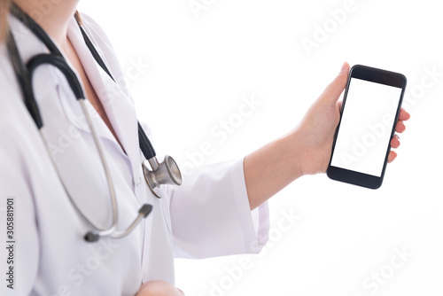Portrait of female doctor using her digital tablet on white background