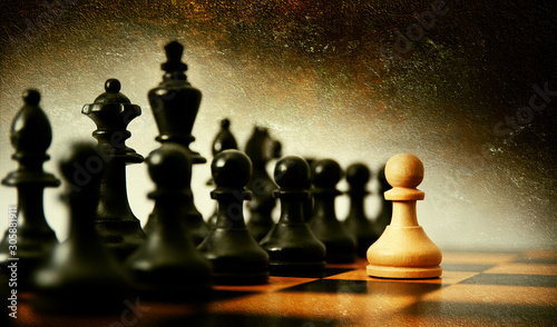 Plan leading strategy of successful business competition leader concept, Hand of player chess board game putting gold pawn
