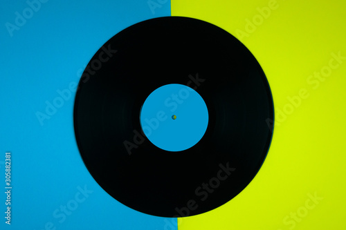 Old vintage record on a colored background.