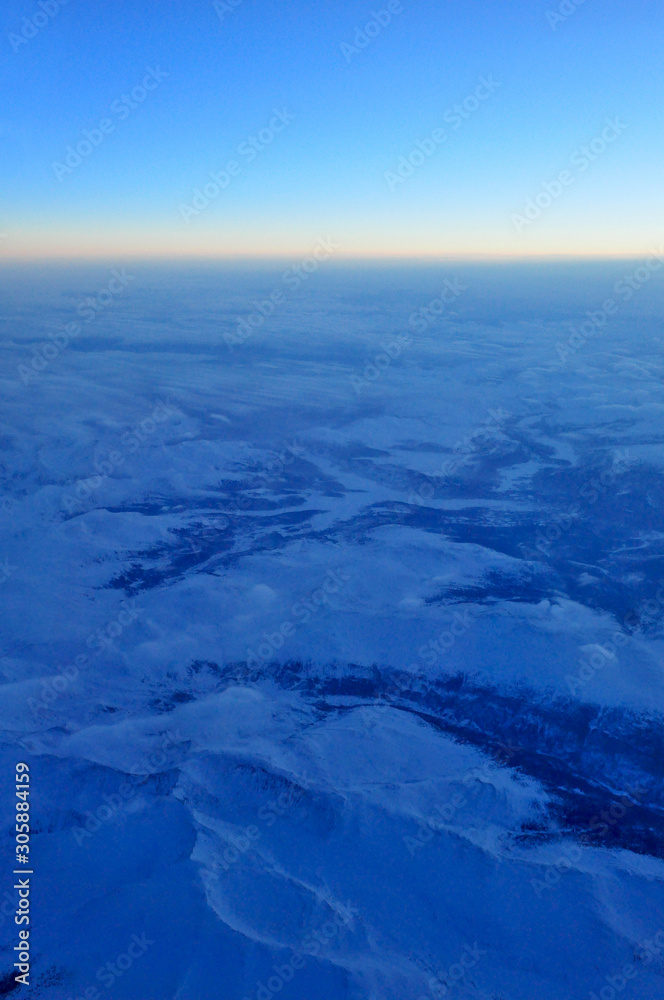 Landscape aerial view from the flight deck of an airliner above Mongolia