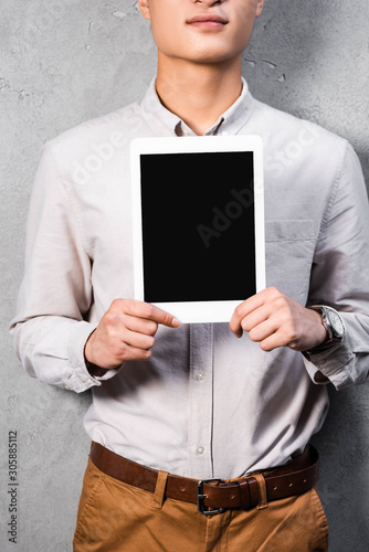 cropped view of seo manager holding digital tablet with copy space