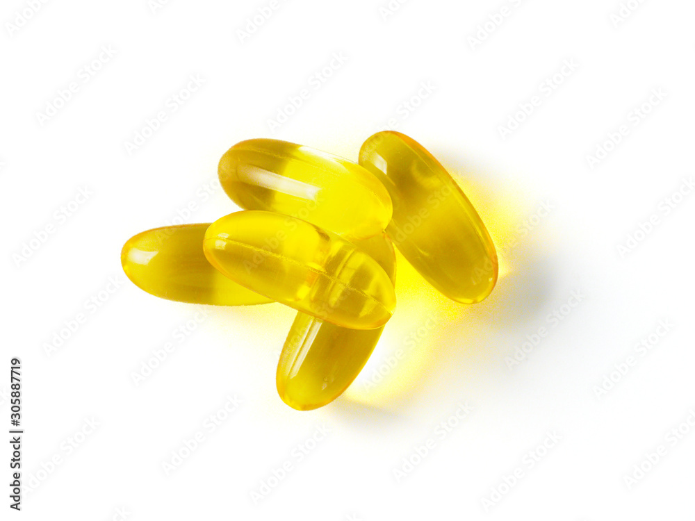 Omega 3 fish oil capsules isolated on white background. Golden color capsules - vitamin E, D or multivitamin. Omega 3 fish oil capsules isolated on white background. Golden color capsules - vitamin E, D or multivitamin.