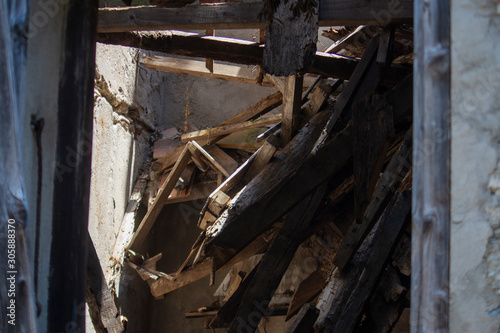 collapsed roof of old abandoned house