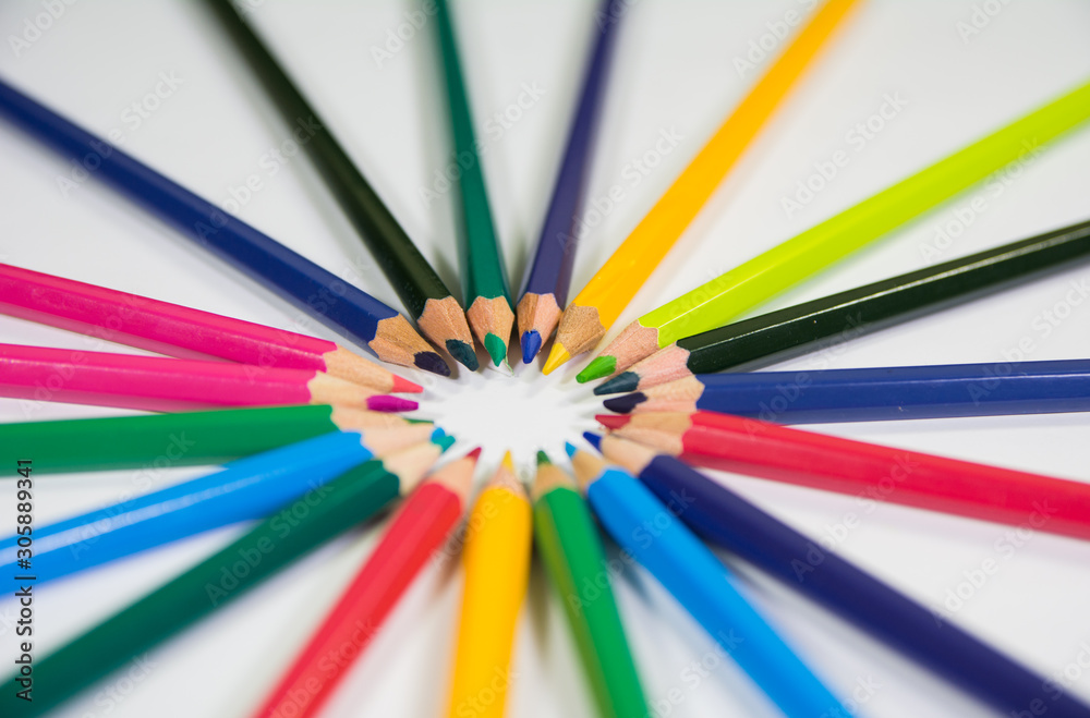 Closup view of set of color pencils in a floral flower circular shape circle pencils in focus