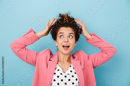 Cheerful excited young girl standing isolated