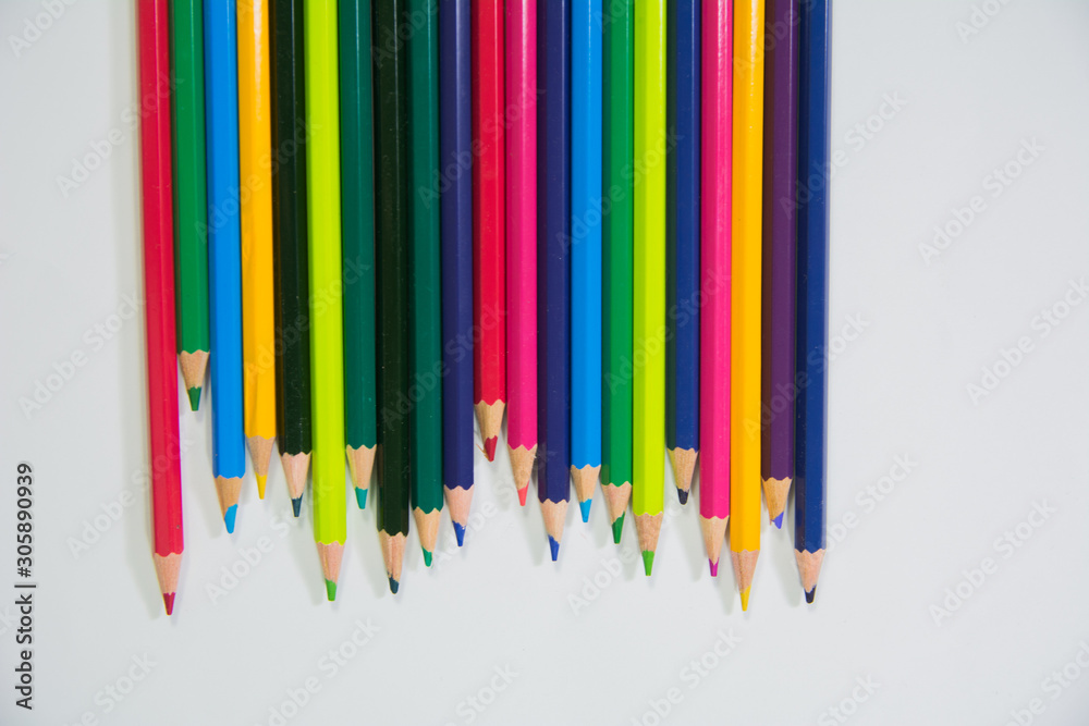 set of wooden color pencils with different lengths with Downside frontal view on white background set of wooden color pencils with different lengths with Downside frontal view on white background