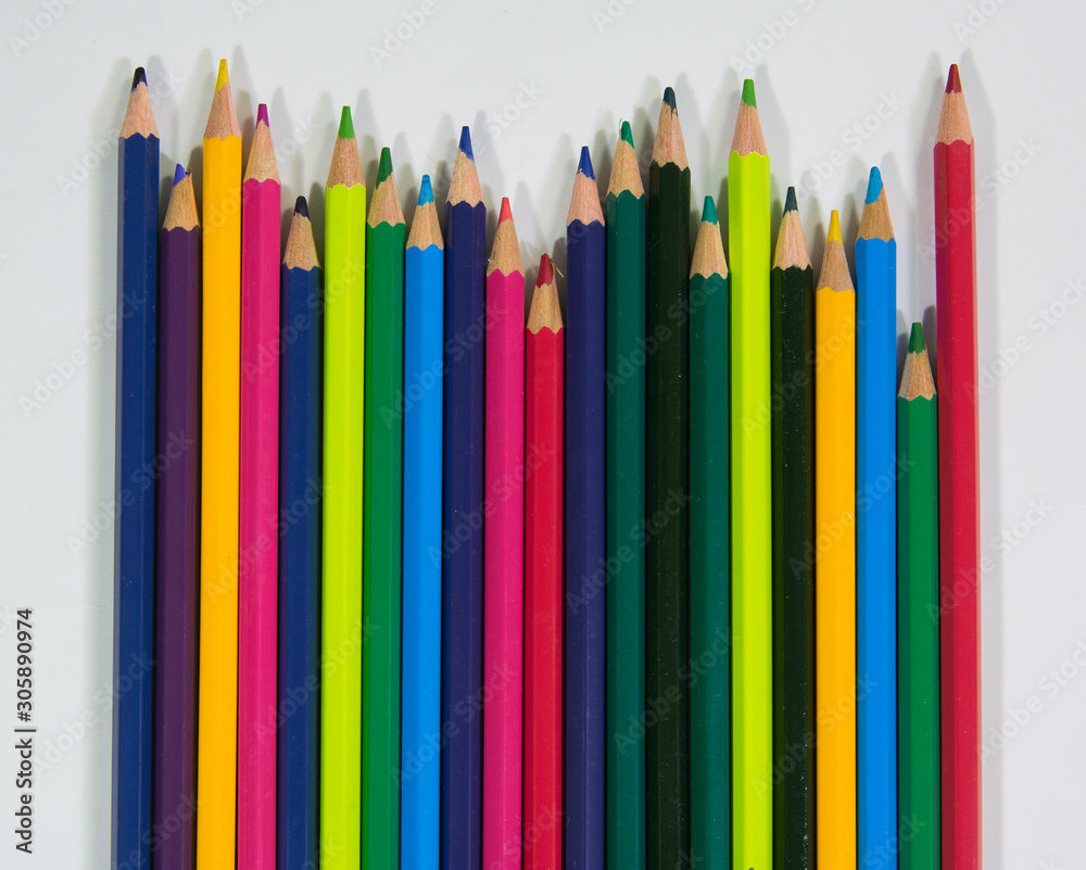 set of wooden color pencils with different lengths with upside frontal view on white background set of wooden color pencils with different lengths with upside frontal view on white background