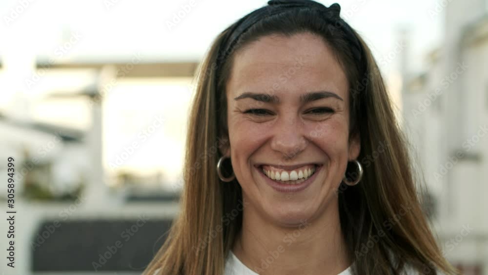 Closeup shot of beautiful smiling woman. Attractive stylish lady with headband looking at camera. Happiness concept Closeup shot of beautiful smiling woman. Attractive stylish lady with headband looking at camera. Happiness concept