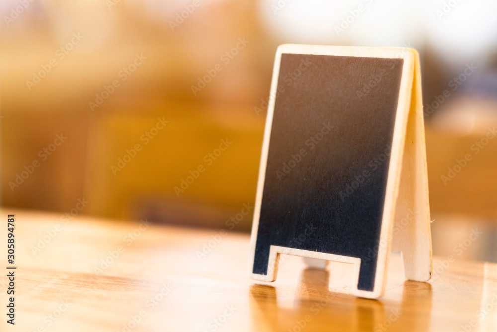 Mini chalkboard on table in cafe with copy space Mini chalkboard on table in cafe with copy space