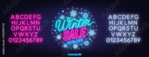 Winter sale neon sign on dark background. Discount template. Neon alphabet on a dark background. Template for design.