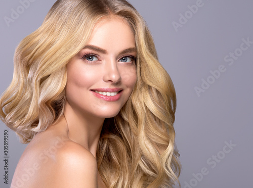 Blonde woman long curly hair beautiful female natural makeup