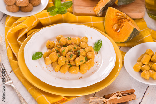 Pumpkin gnocchi with grated amaretti cookies.	
