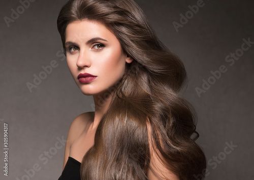 Beautiful hair woman long curly hairstyle natural makeup