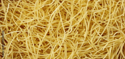 Dry, raw egg pasta noodles background and texture