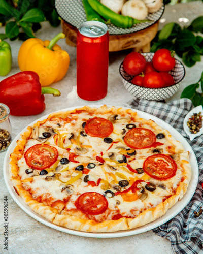 italian pizza with mushroom, tomato, olive and bell pepper