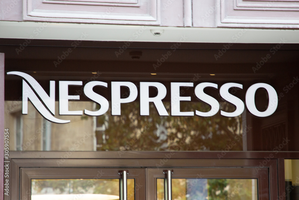 Nespresso logo sign shop coffee machines capsules accessories store foto de  Stock | Adobe Stock
