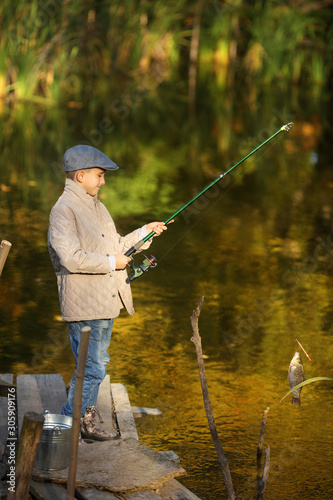 photo of a boy fishing
