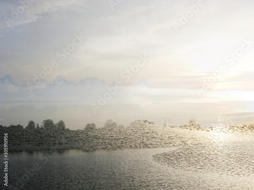 The mixed image of the view of the ice on the surface of the lake and the natural background of the view of the lake shore at the cold spring day at the City Park. 