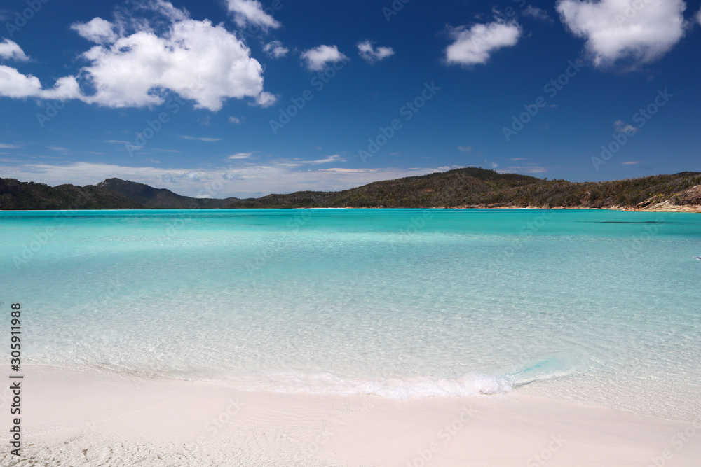Relaxing clear water beach with mountains in the background 2
