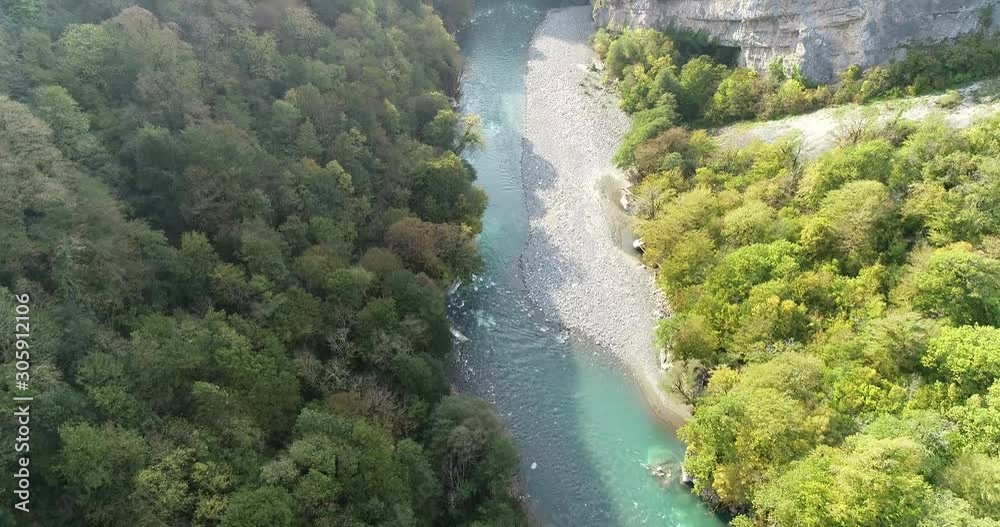 Kodori Gorge in Abkhazia. Autumn nature around the mountain river Kodor in the area of the Bagad rocks. Military Sukhumi road. Kodori Gorge in Abkhazia. Autumn nature around the mountain river Kodor in the area of the Bagad rocks. Military Sukhumi road.