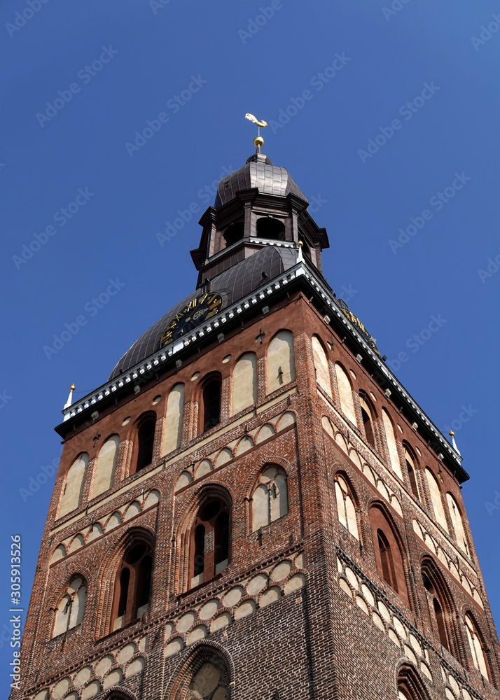 Upper part of the Dome Cathedral in Riga on a sunny day against a blue cloudless sky bottom-up view