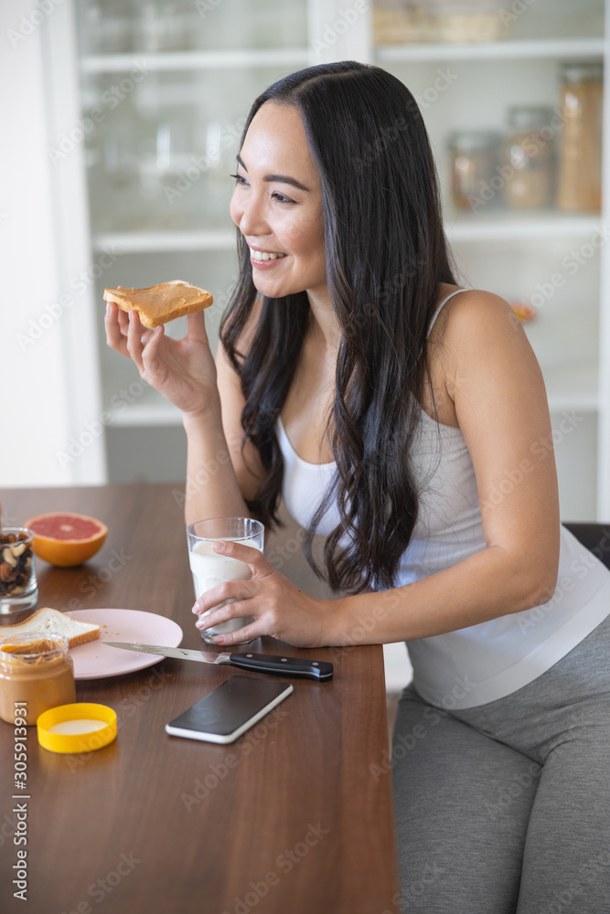 Pretty woman with an almond butter toast Pretty woman with an almond butter toast