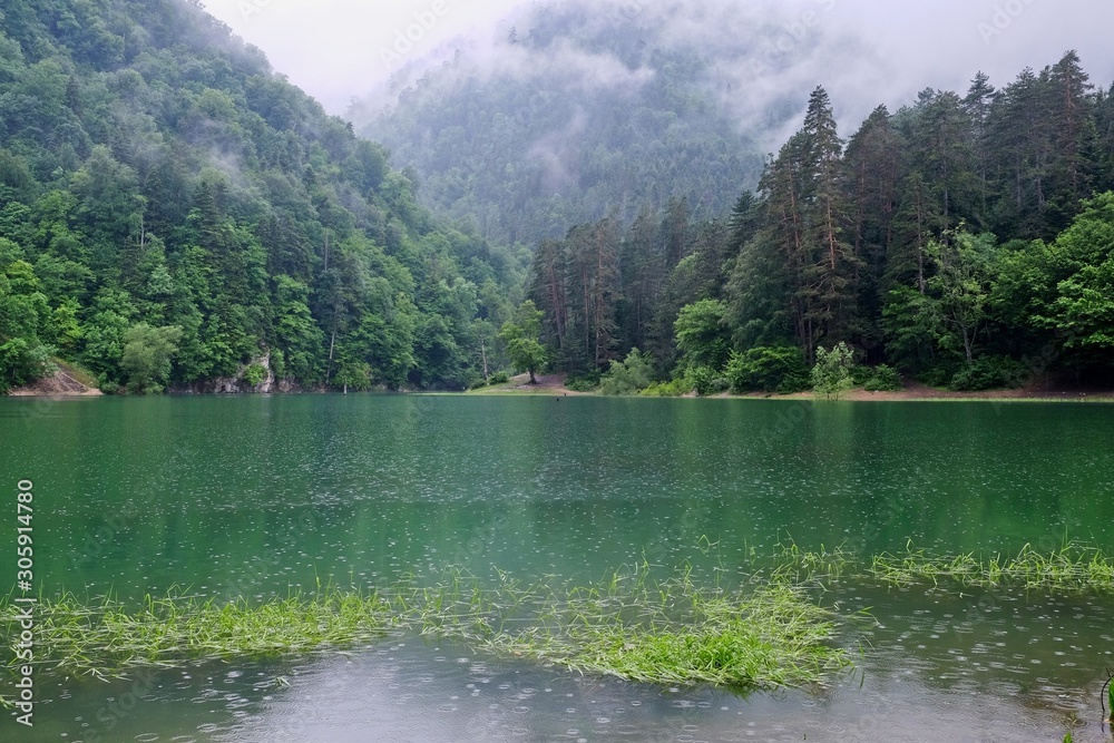 Raindrops falls into the water and the fog is the miracle of nature.A lake in Turkey its name Suluklu Lake.