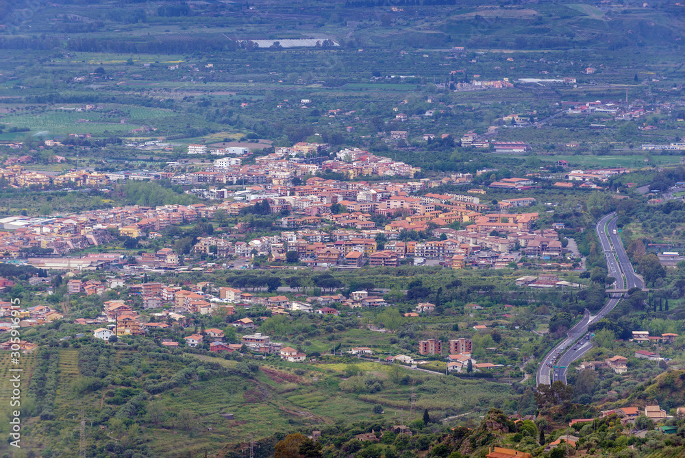 Chianchitta town and A18 motorway seen from  Castelmola, small town on Sicily Island, Italy
