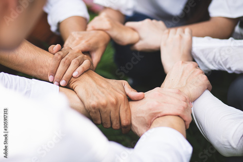 Group people hands were collaboration to trust in business success concept of teamwork partnership in company. Victory as a team, fighting for the success of the organization concept. photo