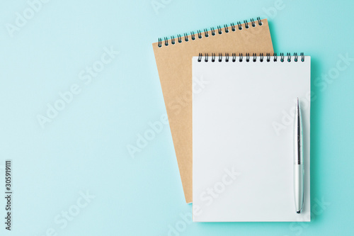 school notebook on cyan color background, Top view