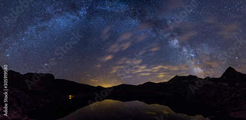 Wilderness and milky way panorama in Ibon de Estanés, Spain photo