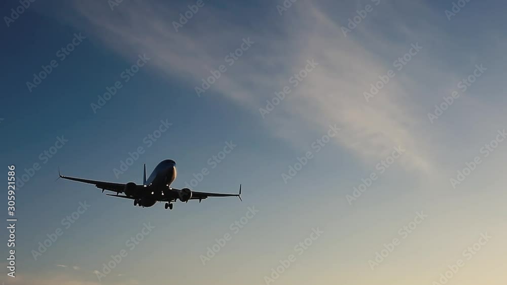 travel by airplane, plane landing in airport at sunset, arrival