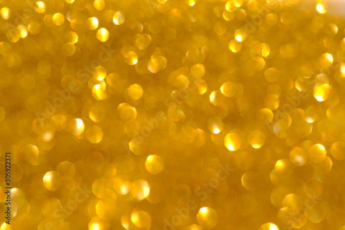 abstract golden background with bokeh lights