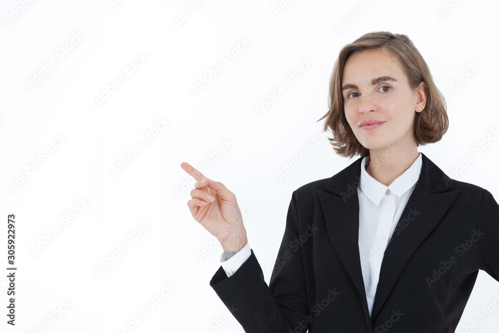 A beautiful business woman in a suit pointed her hand to the right side with a happy face on a white background in the concept of business success and career progress. Presenter. A beautiful business woman in a suit pointed her hand to the right side with a happy face on a white background in the concept of business success and career progress. Presenter.