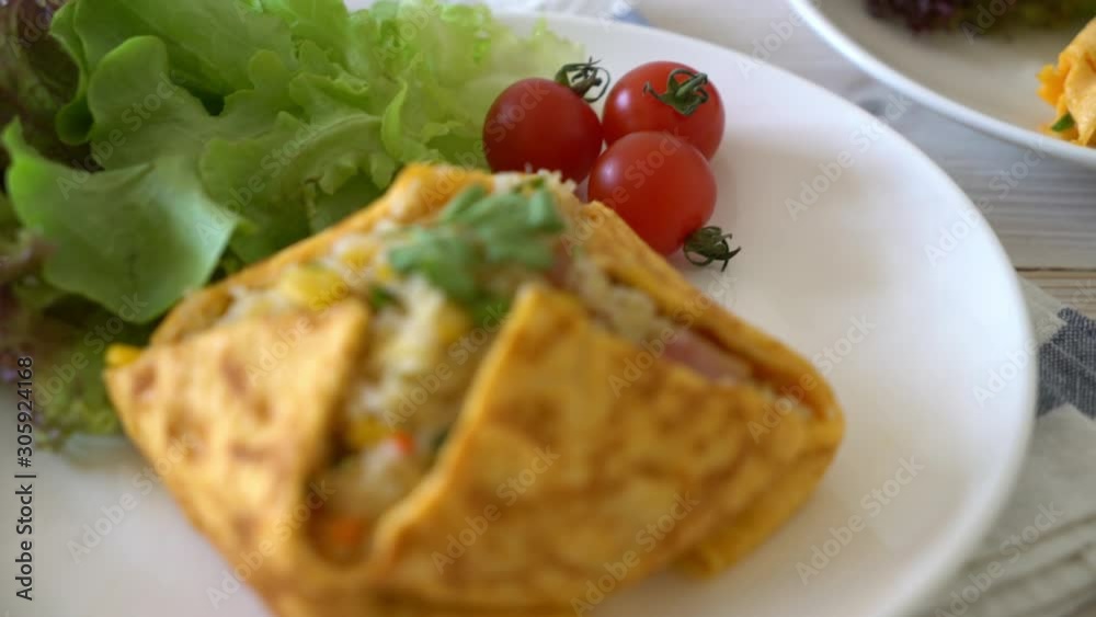 Flavored Fried Rice in an Omelet Wrapping Flavored Fried Rice in an Omelet Wrapping