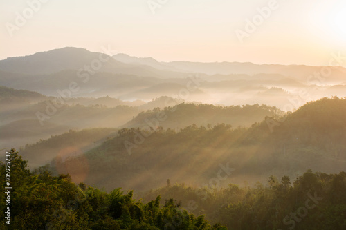 Fototapeta Naklejka Na Ścianę i Meble -  A picture of beautiful sky and cover foggy of layer mountain before sunrise, Thailand.