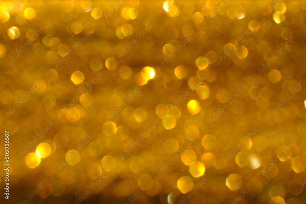 Blurry abstract golden background with bokeh lights Blurry abstract golden background with bokeh lights