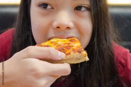 Child eating pizza