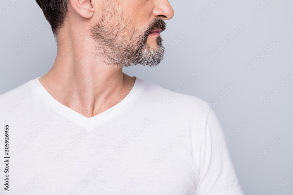Fototapeta premium Closeup cropped photo of attractive aged man seriously looking side empty space mature wrinkles appearance showing nice beard wear white t-shirt isolated grey color background