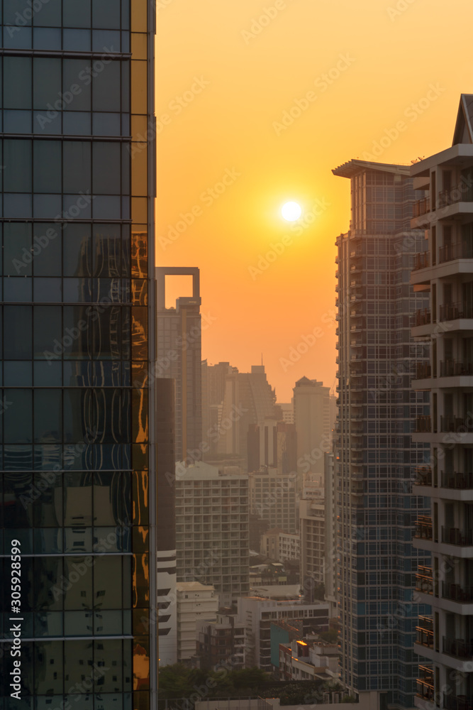 Sunrise at morning at Bangkok metropolis. Building in big city. Shade for shadow orange light. Sunrise at morning at Bangkok metropolis. Building in big city. Shade for shadow orange light.