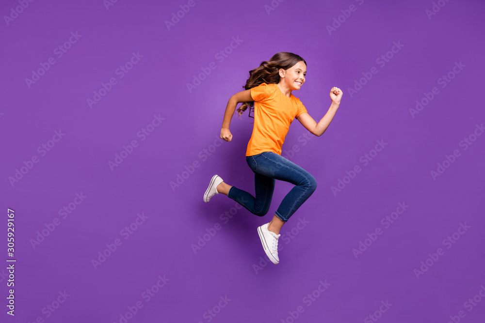 Full length body size profile side view of her she nice attractive glad cheerful cheery wavy-haired girl jumping running hobby free time isolated over lilac purple violet pastel color background