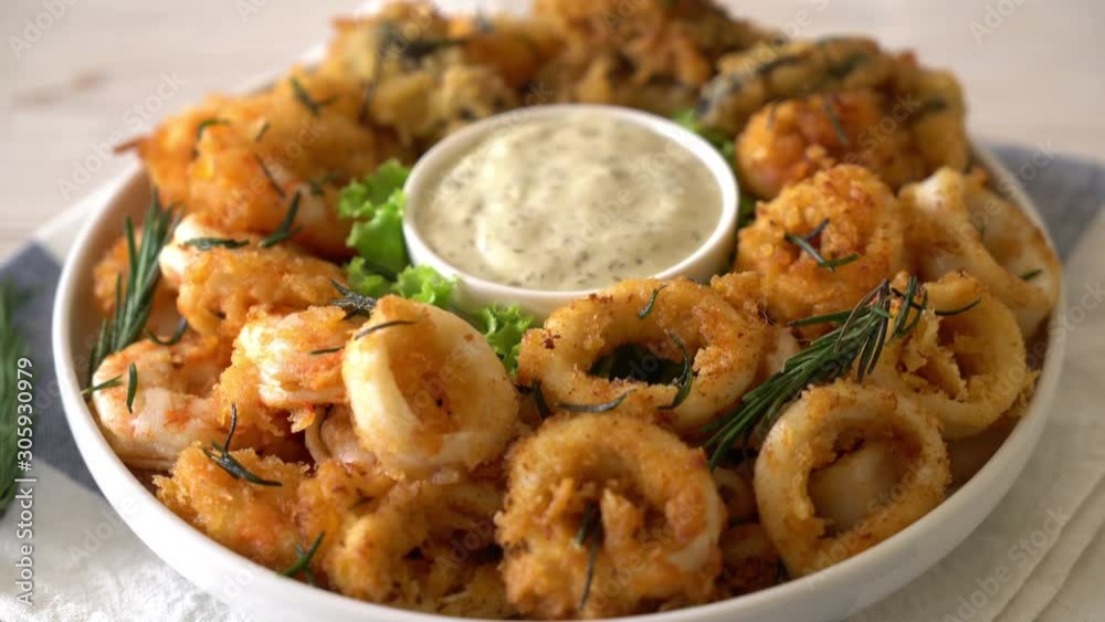 fried seafood (squids, shrimps, mussels) with sauce fried seafood (squids, shrimps, mussels) with sauce