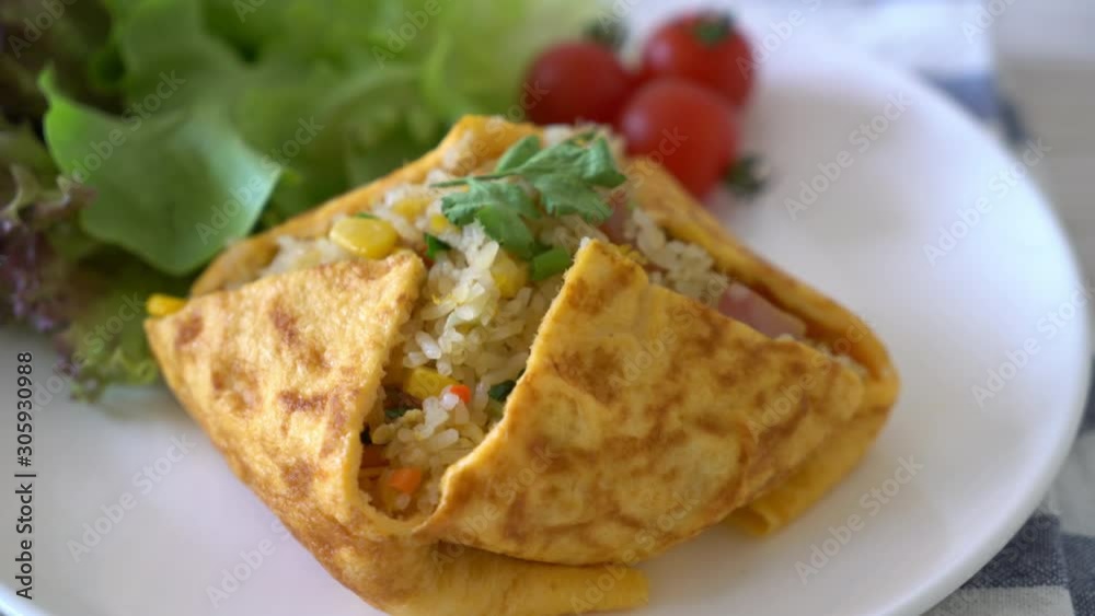 Flavored Fried Rice in an Omelet Wrapping Flavored Fried Rice in an Omelet Wrapping