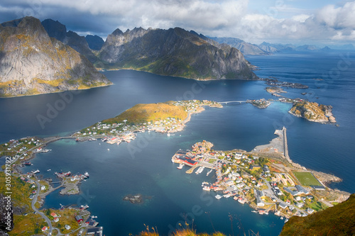 Lofoten Islands, Norway, panorama of the city of Reine from the top of the Reinebringen mountain in sunny autumn day