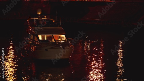 Fotografie Luxurious modern private yacht and boat at the pier at night