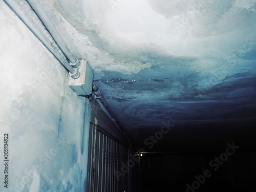 Фотография dampness moisture on ceiling with drops of water infiltration